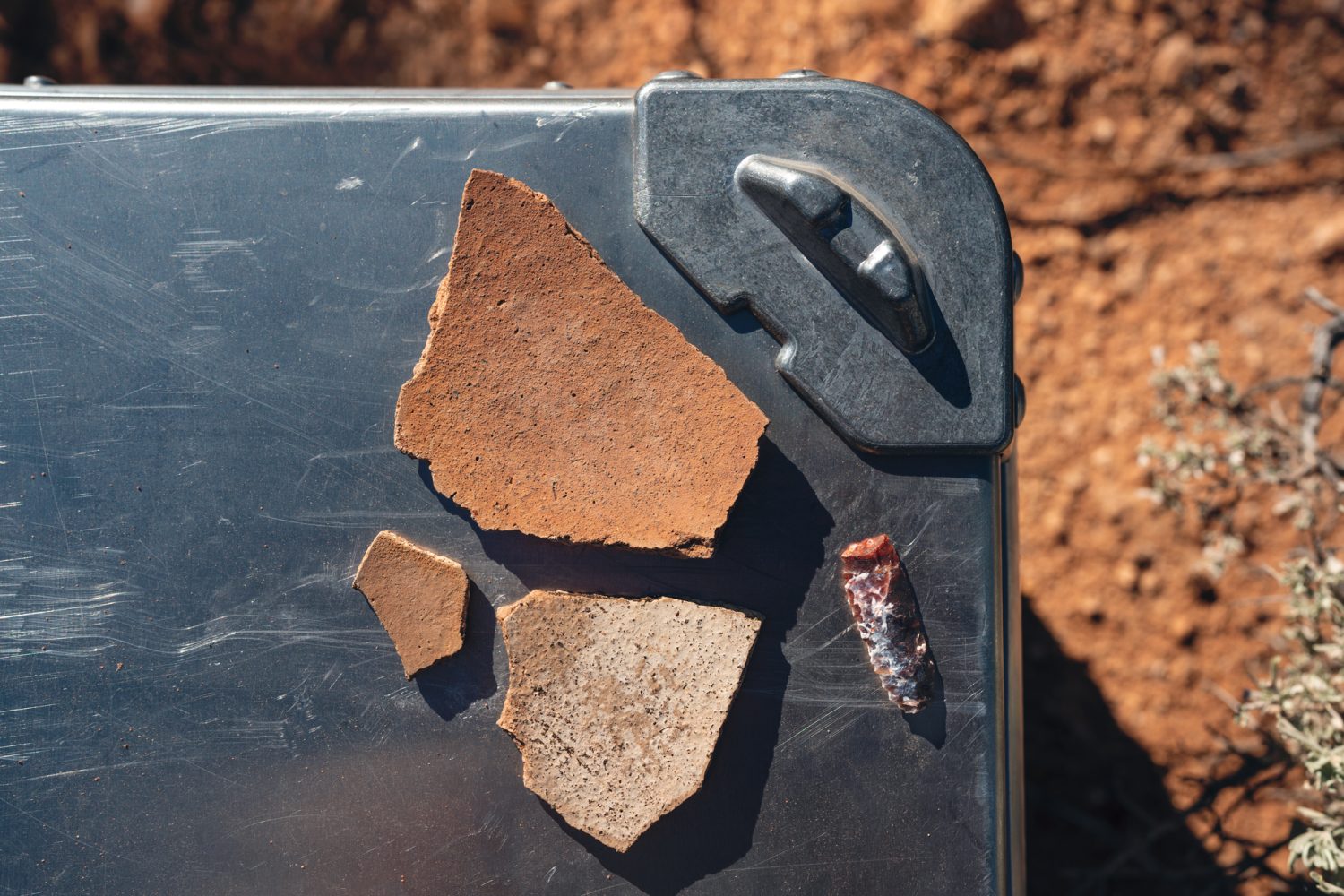 southwestern desert artifacts: potshards, arrow head.