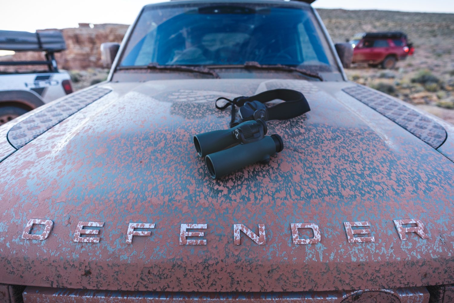 muddy Defender with a pair of swarovski binoculars on the hood