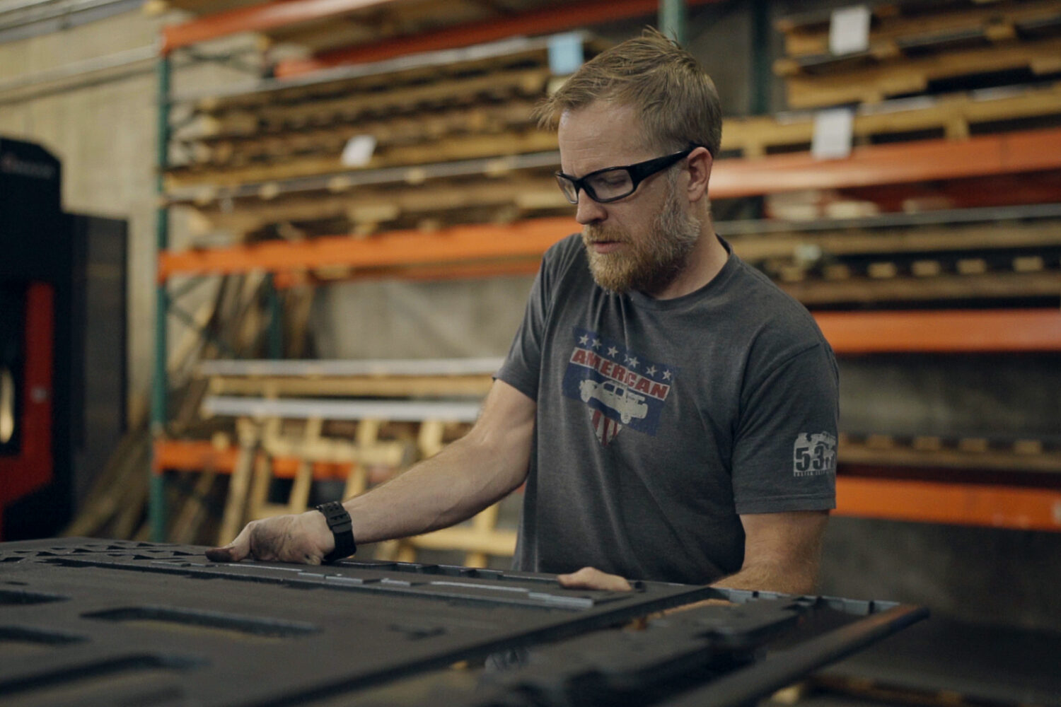 James Fonnesbeck inspecting laser-cut parts