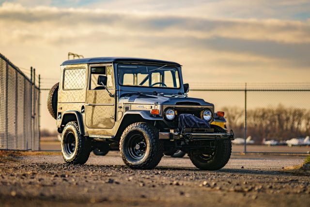 Vintage Toyota Land Cruiser Illustration Amidst Vibrant Nature | MUSE AI