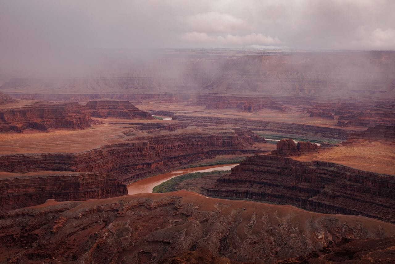 Colorado River winding through the canyons below Dead horse Point as a storm clears