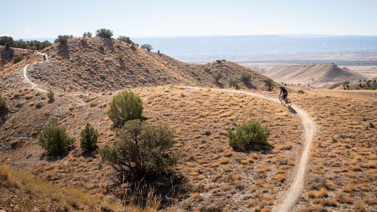 Mountain bike descending Joe’s Ridge trail at 18 Road trails area of the North Fruita Desert. 