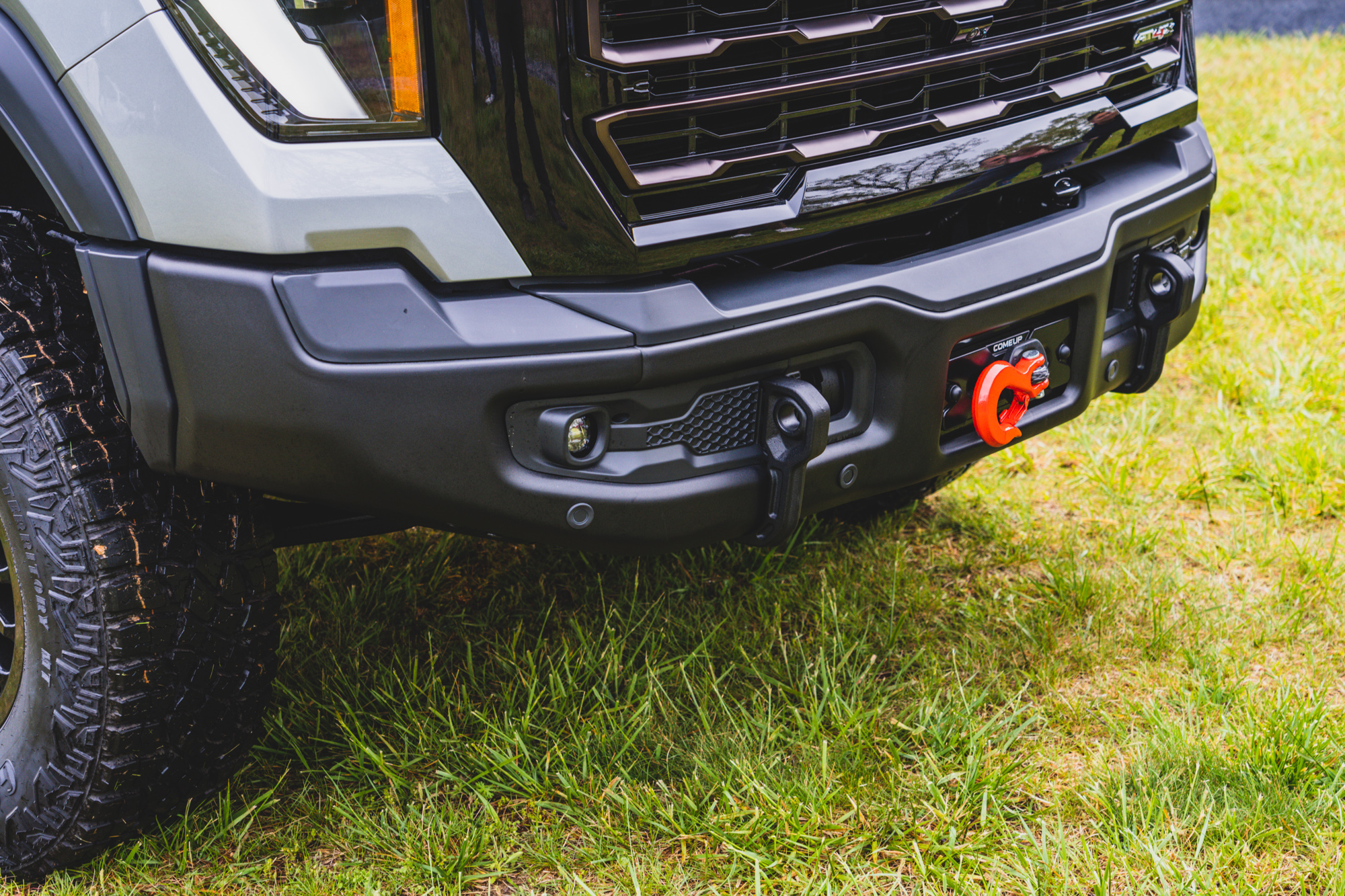 The AEV front bumper is a foundational piece, providing improved clearance, replaceable corners, nodular iron GVWR recovery points (which function as skidding ramps for ledges), fog lamps, and the provision for a Come Up 12,000 pound winch. The details abound, like the extended free spool handle, which is accessible just below the grill. Further inspection also revealed that the top of the bumper is covered by a plastic insert, which would be easily removed, and provide improved access to the winch line. 