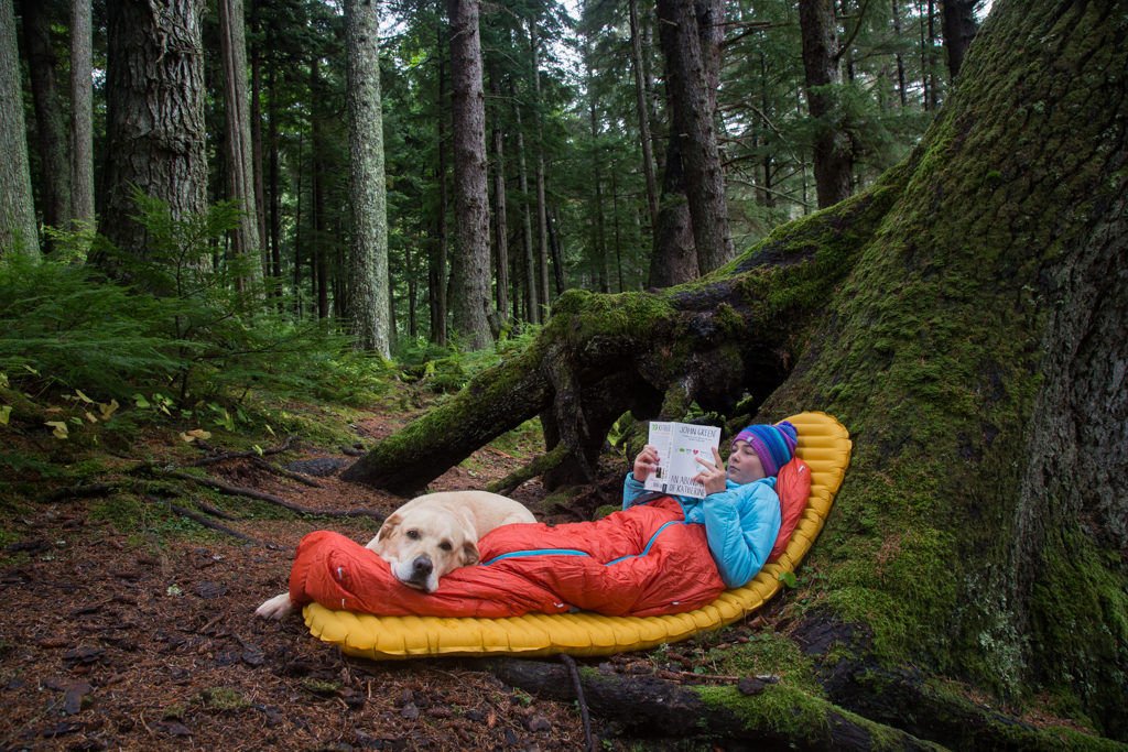 child reading in the woods