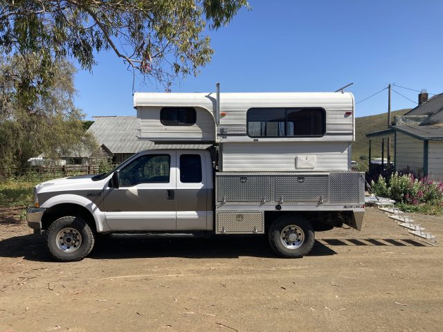 F250 with an Alaskan pop top camper. 