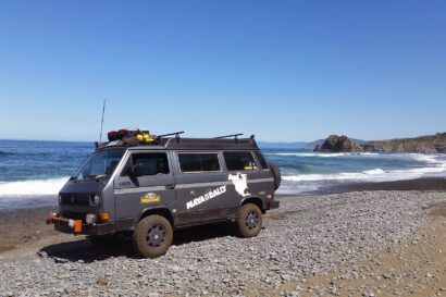 A Volkswagen T3 Syncro on the beach