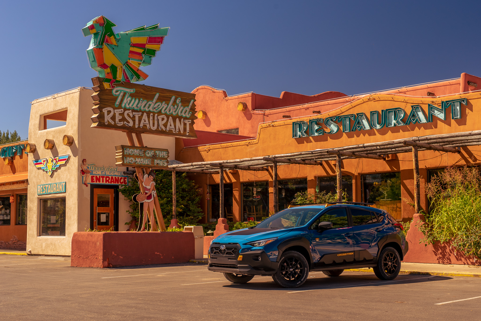 2024 Subaru Crosstrek Wilderness parked in front of a retro-themed diner