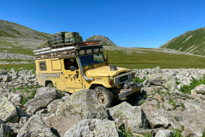 Man and Machine - Land Cruiser driving in a field of rocks