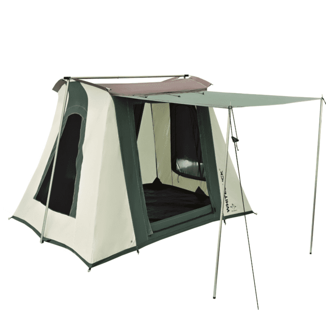 A large, green and beige canvas tent featured in Overland News, with mesh windows, an extended awning supported by poles and guy lines, and an open front entrance—perfectly designed for camping.