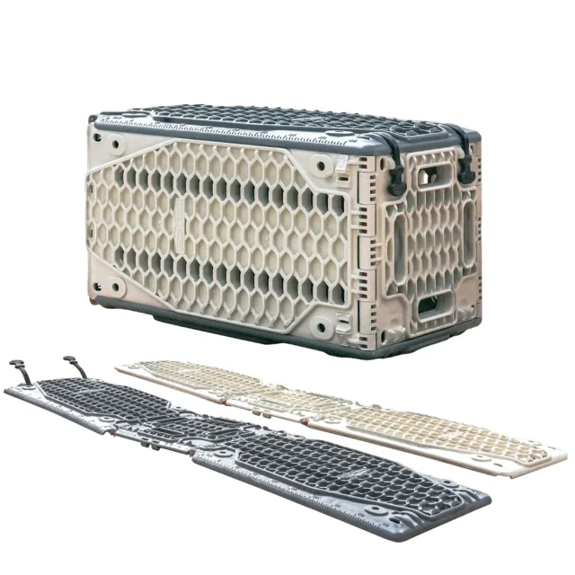 A sturdy, foldable plastic storage crate with a honeycomb pattern is shown assembled and disassembled—perfect for Overland News enthusiasts. The gray and beige crate features handles and interlocking parts for easy transport and compact storage.