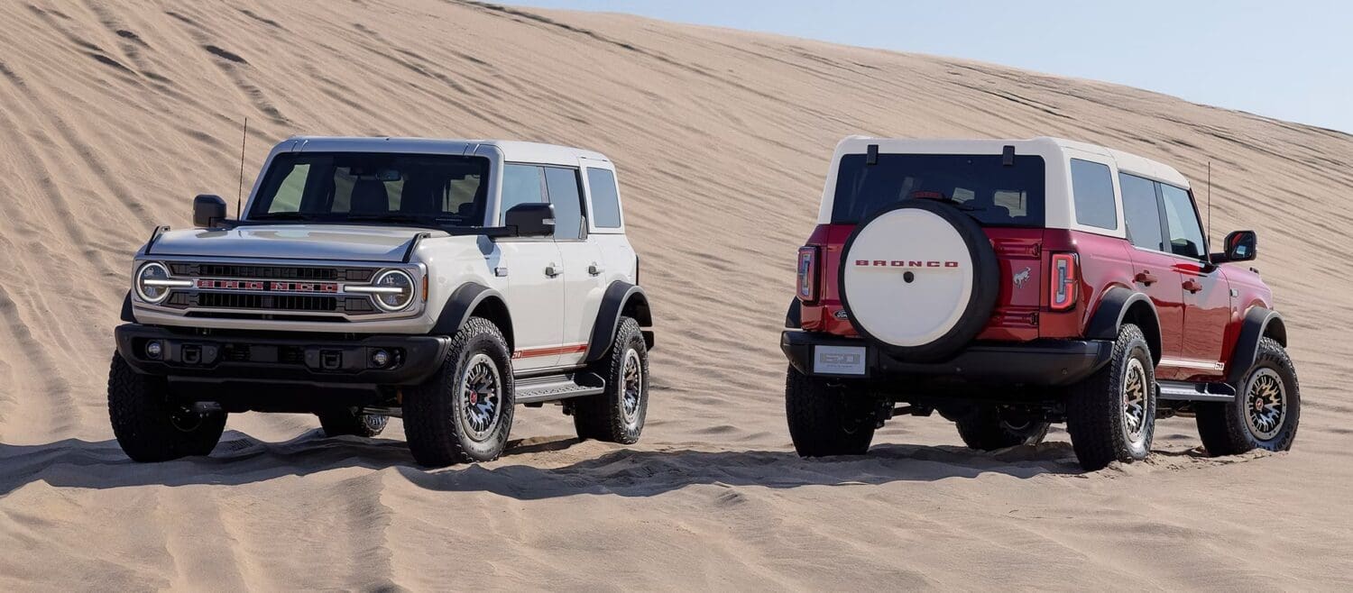 Ford Broncos on a sand dune