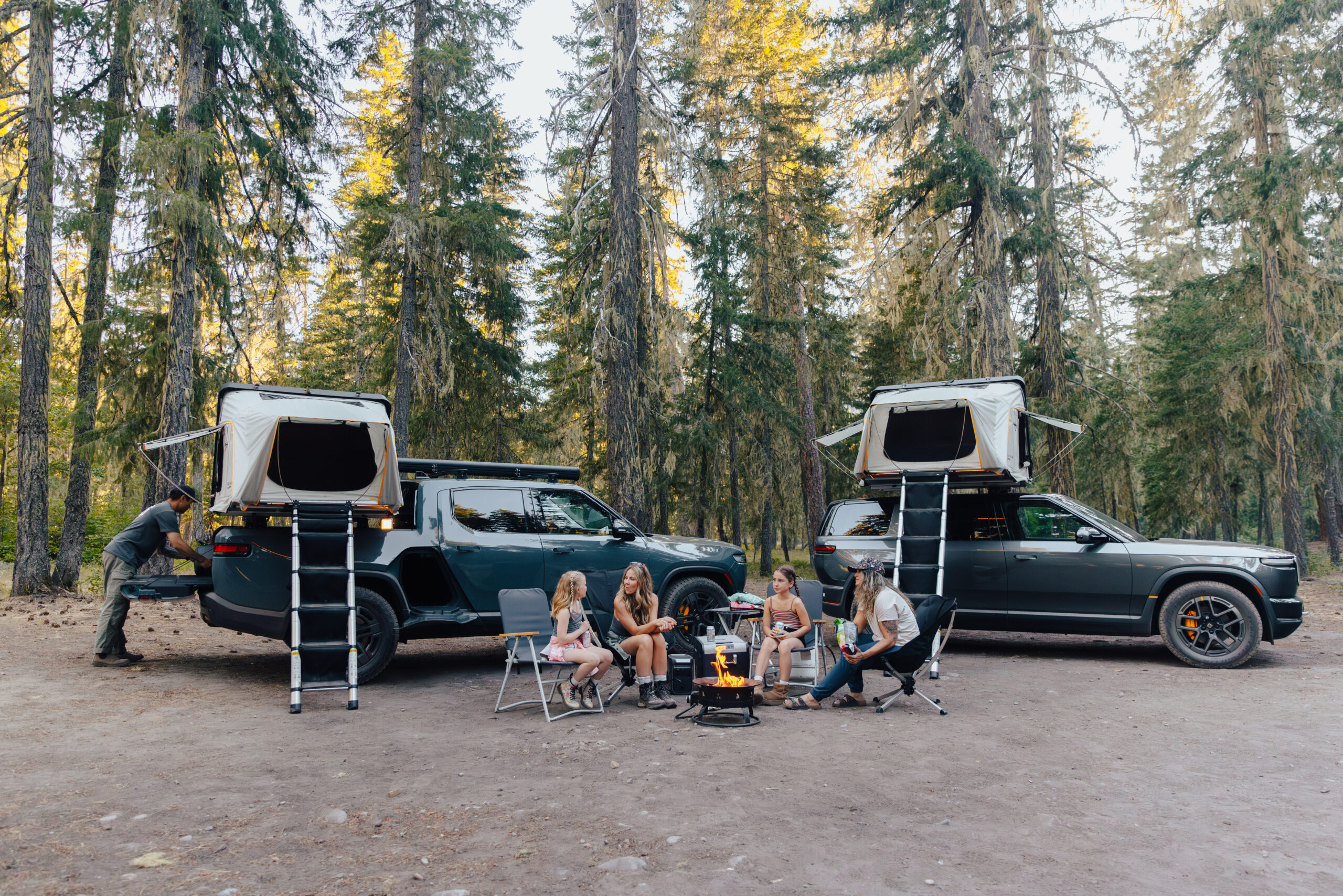 family camping with two rooftop tents on vehicles