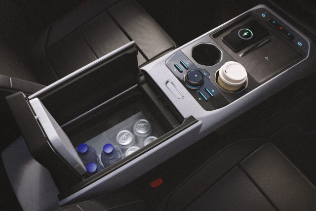 A Ford Bronco’s center console with water bottles and cans in a refrigerated compartment, cupholders with coffee cups, and a modern control panel featuring blue accent lights.