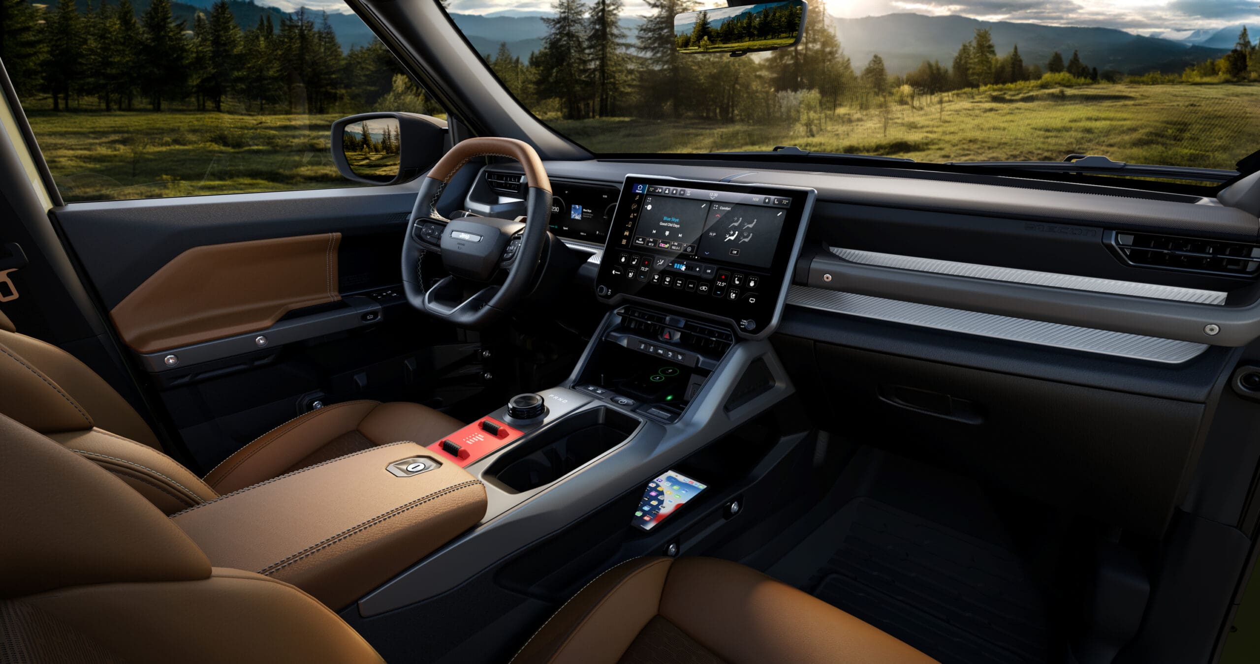 Modern SUV interior with brown leather seats, large touchscreen display, digital dashboard, and scenic view of trees, grass, and mountains through the windshield in the background. Sunlight streams through the window, highlighting the refined craftsmanship reminiscent of a Jeep Recon.