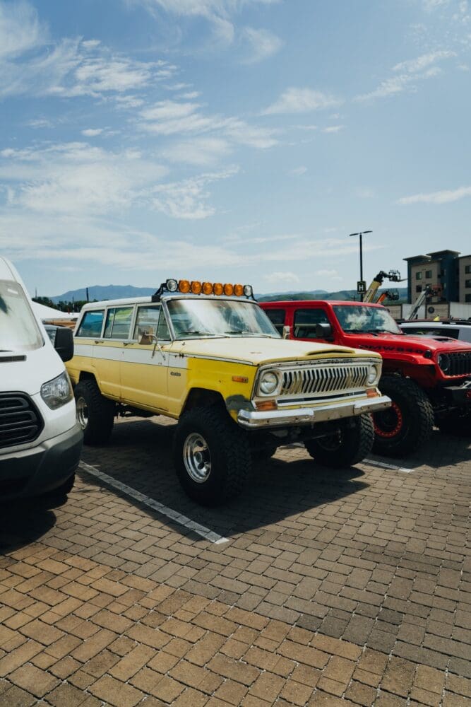 Classic yellow Jeep Wagoneer on display at Jeep Invasion
