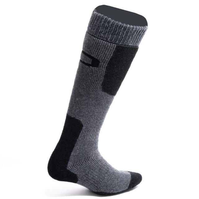 A thick, knee-high sock in shades of gray and black, displayed upright to show its padding and ribbed texture—a practical choice for any journey featured in Overland News.