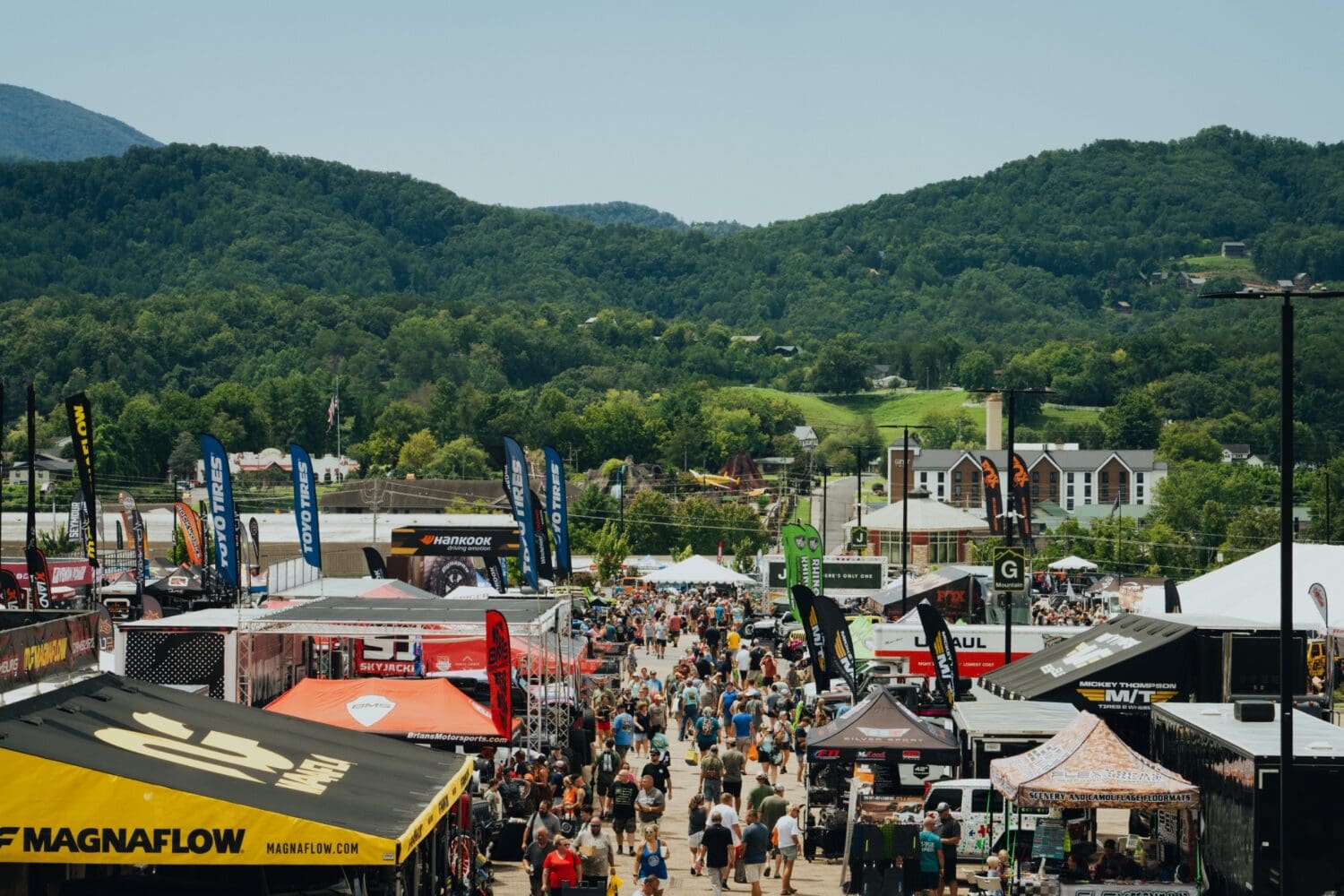 Crowds and vendor booths at Smoky Mountain Jeep Invasion in Pigeon Forge, Tennessee