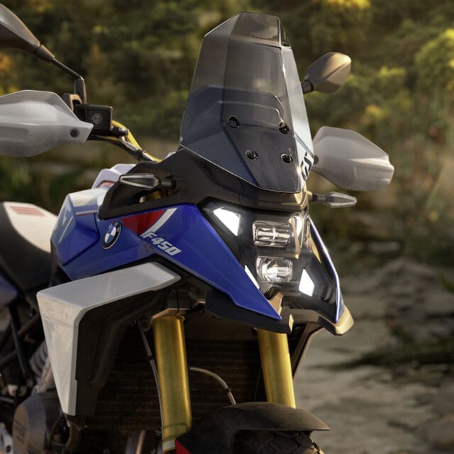 A front view of a blue and white BMW Motorrad F 450 GS adventure motorcycle.