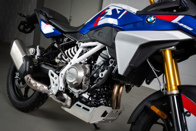 Side view of a blue, white, and red BMW Motorrad F 450 GS adventure motorcycle.